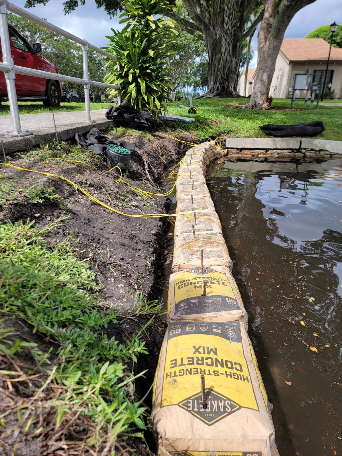 Building the cement bag wall — rip rap cement bag retaining wall