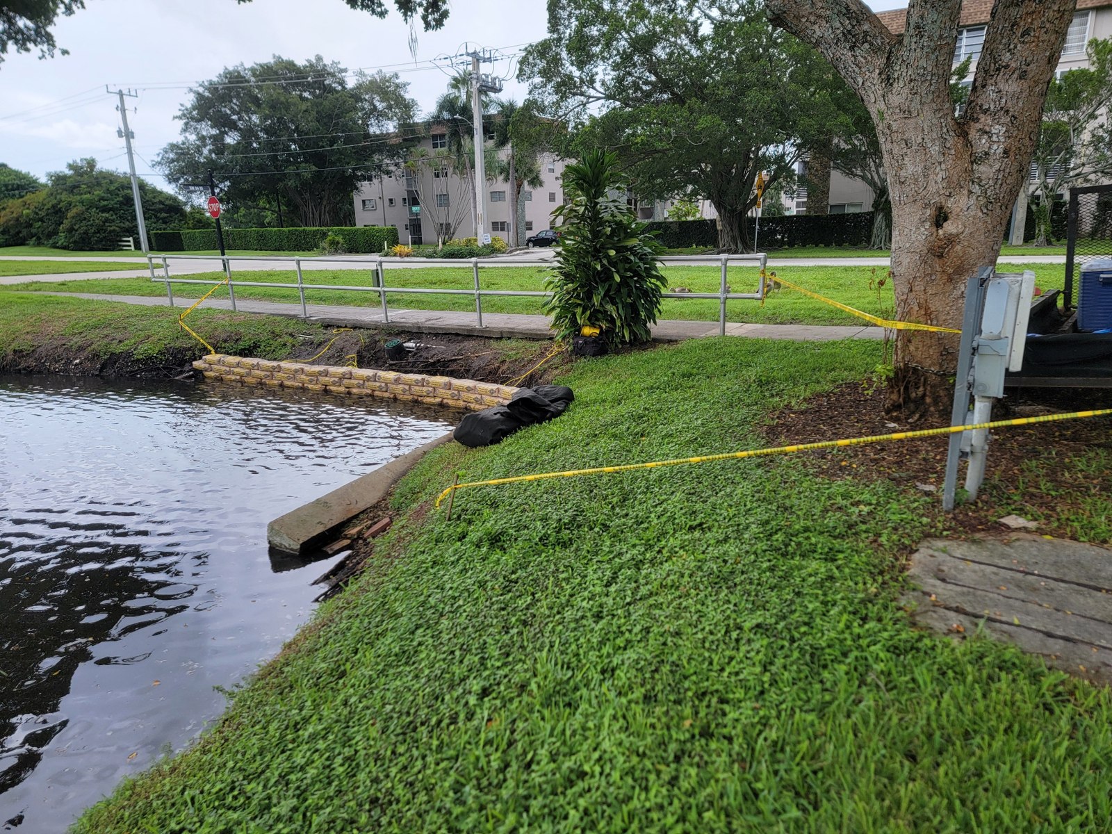 Wall alignment along the bank — rip rap cement bag retaining wall