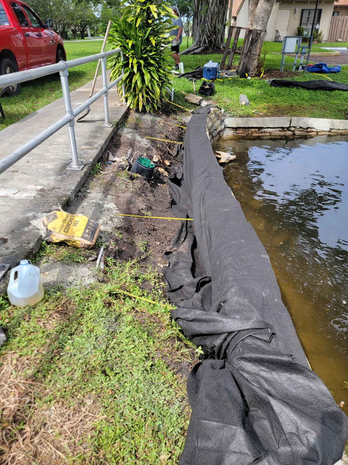 Fabric behind the wall — rip rap cement bag retaining wall
